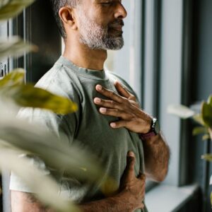 Man practising mindful breathing for the NeuroSync Academy breathing webinar